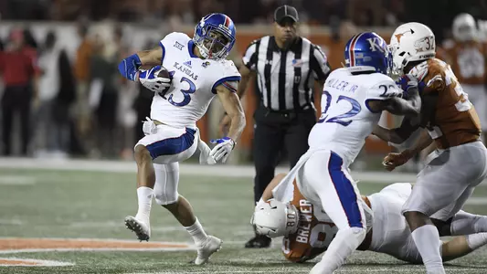 First half turnovers haunt Kansas in 42-27 loss to Texas Image