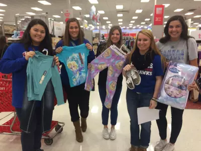‘Tis the Season for KU Softball to Give Back Image