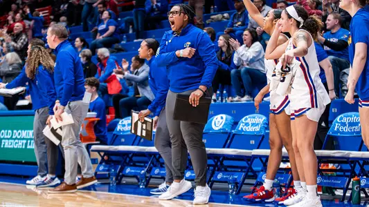 LAWRENCE, KS - January 13, 2024 - Assistant Coach Marqu'es Webb of the Kansas Jayhawks during the game between the Kansas Jayhawks and the Oklahoma State Cowgirls. Photo by Angilo Allen/Kansas Athletics