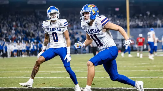 PHOENIZ, AZ - December 26, 2023 - wide receiver Luke Grimm #11 of the Kansas Jayhawks and wide receiver Quentin Skinner #0 of the Kansas Jayhawks during the game between the University of Nevada Las Vegas Rebels and the Kansas Jayhawks in the Guaranteed Rate Bowl at Chase Field in Phoenix, AZ. Photo by Aiden Droge/Kansas Athletics