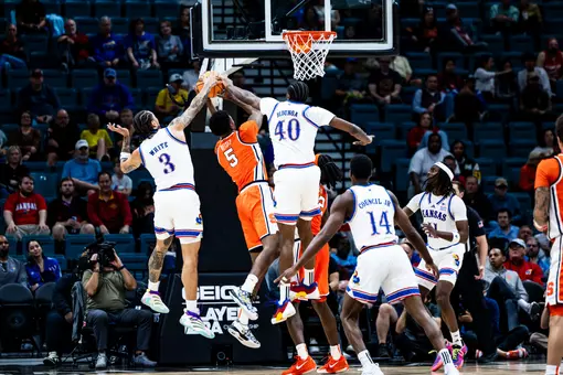 Double-doubles by Tre White and Flory Bidunga help Kansas beat Syracuse 71-60 at Players Era tourney