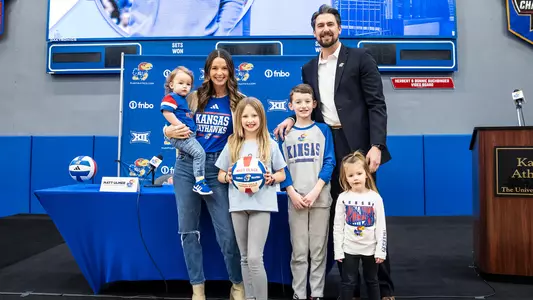 Lawrence, Kansas - January 21, 2025 - Head Coach Matt Ulmer of the Kansas Jayhawks and family during the Press Conference in Horejsi Family Volleyball Arena in Lawrence, KS. Photo by Emma Crouch/Kansas Athletics