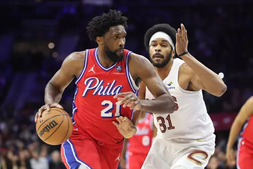 Jan 16, 2026; Philadelphia, Pennsylvania, USA; Philadelphia 76ers center Joel Embiid (21) dribbles past Cleveland Cavaliers center Jarrett Allen (31) during the second quarter at Xfinity Mobile Arena. Mandatory Credit: Bill Streicher-Imagn Images
