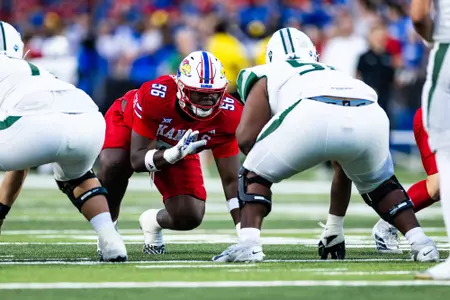 defensive tackle Marcus Calvin #56 of the Kansas Jayhawks