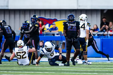 defensive tackle Marcus Calvin #56 of the Kansas Jayhawks