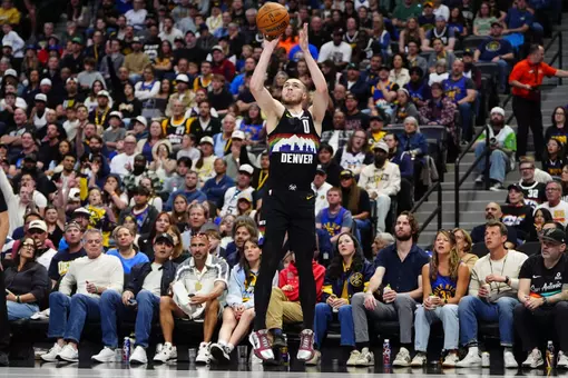 Apr 4, 2026; Denver, Colorado, USA; Denver Nuggets guard Christian Braun (0) shoots the ball in the second quarter against the San Antonio Spurs at Ball Arena. Mandatory Credit: Ron Chenoy-Imagn Images