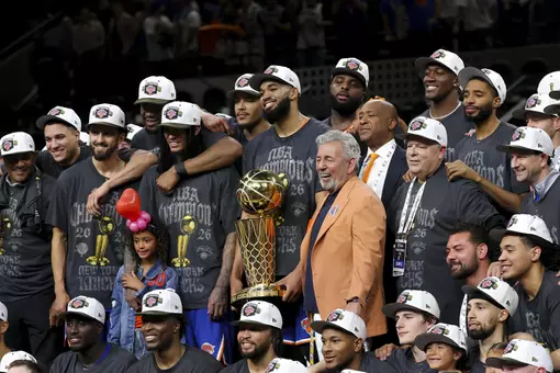 Jun 13, 2026; San Antonio, Texas, USA; New York Knicks owner James Dolan and the Knicks pose with the trophy after the Knicks defeat the San Antonio Spurs during game five of the 2026 NBA Finals at Frost Bank Center. Mandatory Credit: Geoff Burke-Imagn Images