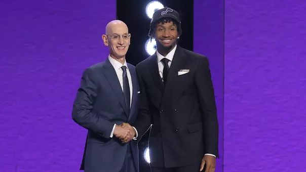 Jun 23, 2026; New York, NY, USA; NBA commissioner Adam Silver greets the second pick in the 2026 NBA draft, Kansas guard Darryn Peterson after he was selected by the Utah Jazz at Barclays Center. Mandatory Credit: Brad Penner-Imagn Images