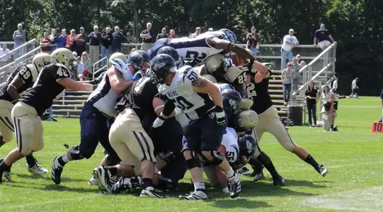 Football Overwhelms Bryant, 51-7 Image