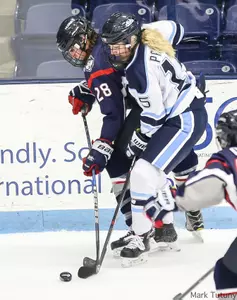 Ida Press positions to take the puck