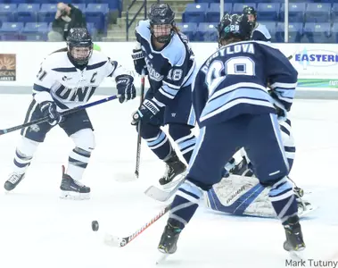 Johnson, Pribylova fight in deep for the puck