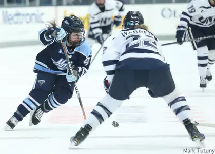 Liga Miljone tracks puck with pressure