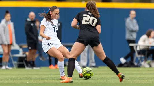 Julie Lossius kicks the ball against Bryant.