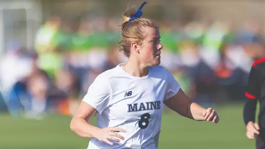 Lara Kirkby runs up the field.