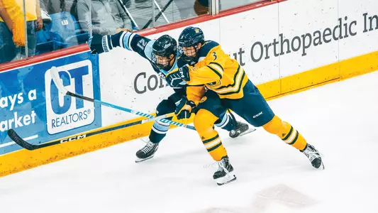 Reid Pabich battles for the puck
