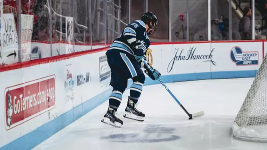 Thomas Freel carries the puck behind the net at BU.
