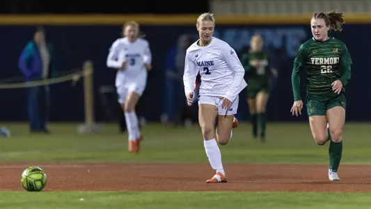 Rebecca Grisdale dribbles the ball up the field.