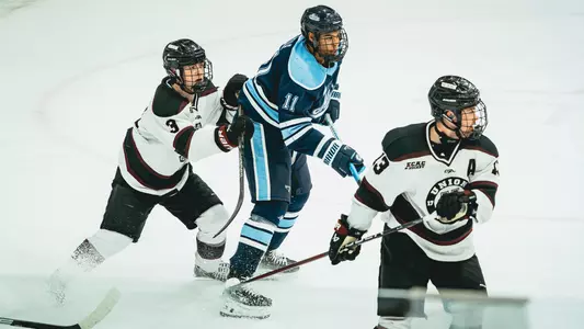Donavan Villeneuve-Houle fights for position in front of the net.