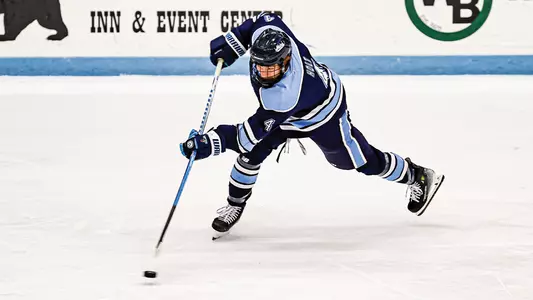 Brandon Holt shoots the puck.