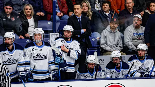 Head coach Ben Barr on the bench.
