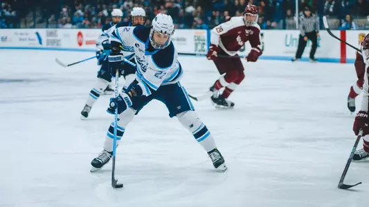 Harrison Scott backhands the puck in the offensive zone.