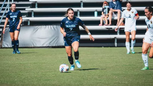 Kristina Kelly carries the ball.