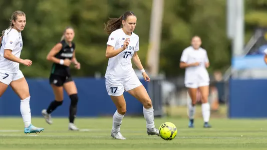 Julie Lossius carries the ball.