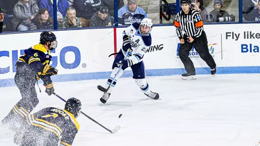 Harrison Scott shoots the puck.
