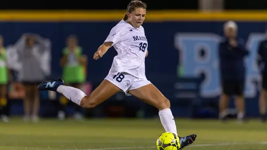 Myla Schneider kicks the ball.