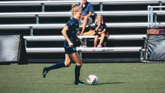 Abbey Thornton dribbles the ball.