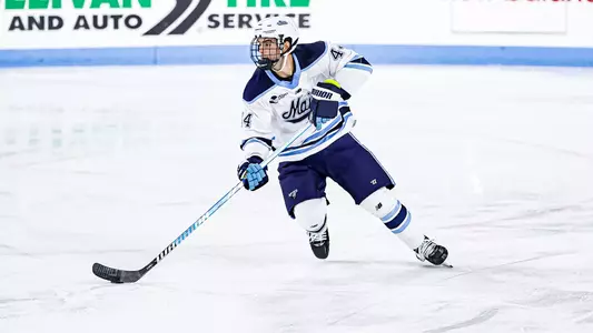 Frank Djurasevic with the puck