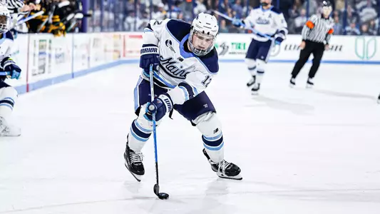 Owen Fowler with the puck