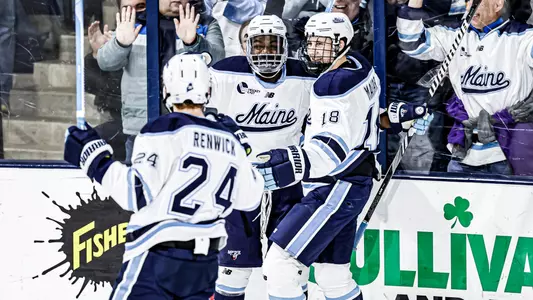 Maine men's ice hockey celebrates a goal.