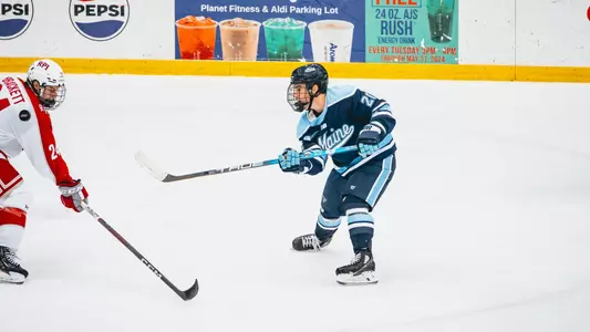 Josh Nadeau shoots the puck