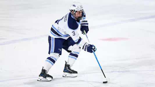 Luke Antonacci carries the puck through the neutral zone.