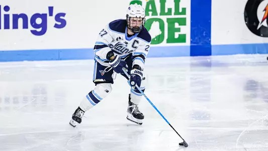 Lynden Breen passes the puck.