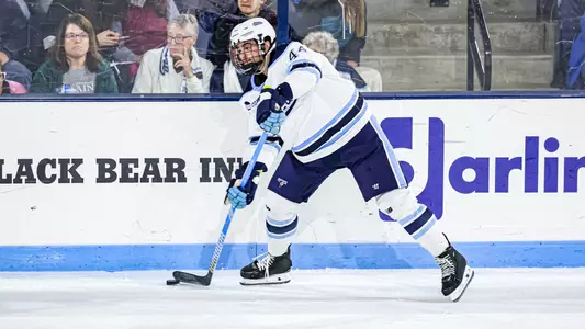Frank Djurasevic dumps the puck into the zone.