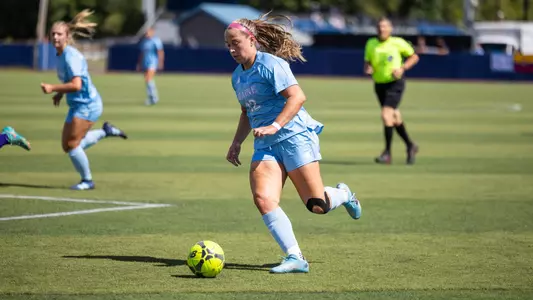 Abby Kraemer dribbles the ball.