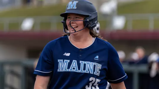 Nora Campo walks to home plate.
