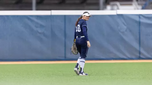 Keira Inman walks in the outfield