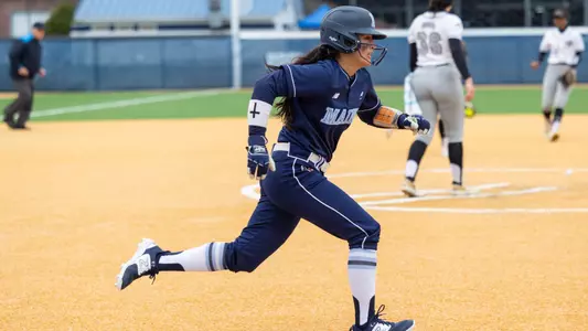 Krista Francia runs to first base.