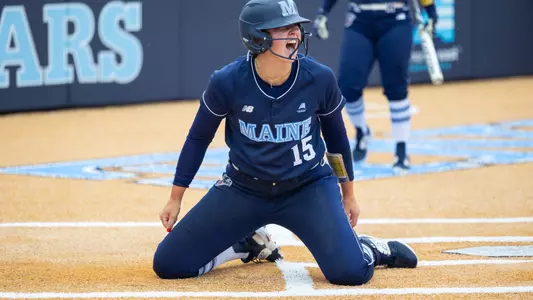 Cat Fallon celebrates scoring a run