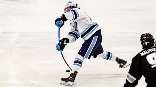 Bradly Nadeau shoots the puck.