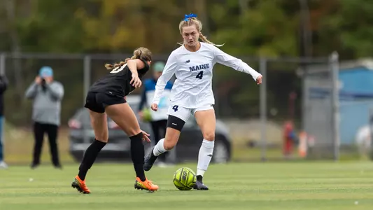 Emma Schneider dribbles up the field.