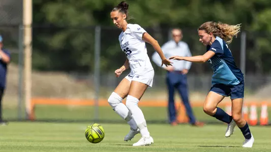 Madison Michaud dribbles up the field.