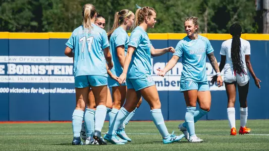 women's soccer celebrates a goal