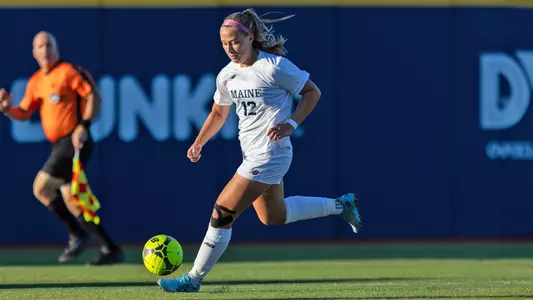 Abby Kraemer dribbles the ball