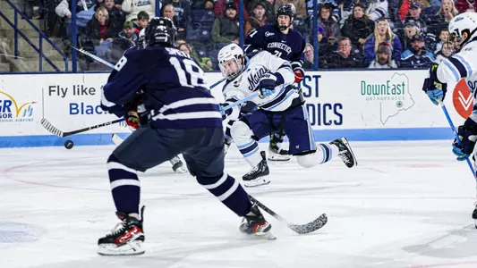 Oskar Komarov shoots the puck.