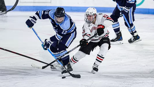 Owen Fowler battles for the puck.