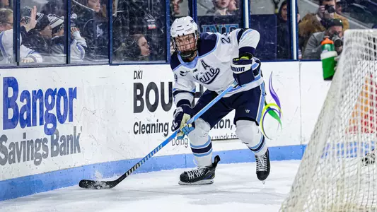 Nolan Renwick carries the puck behind the net.